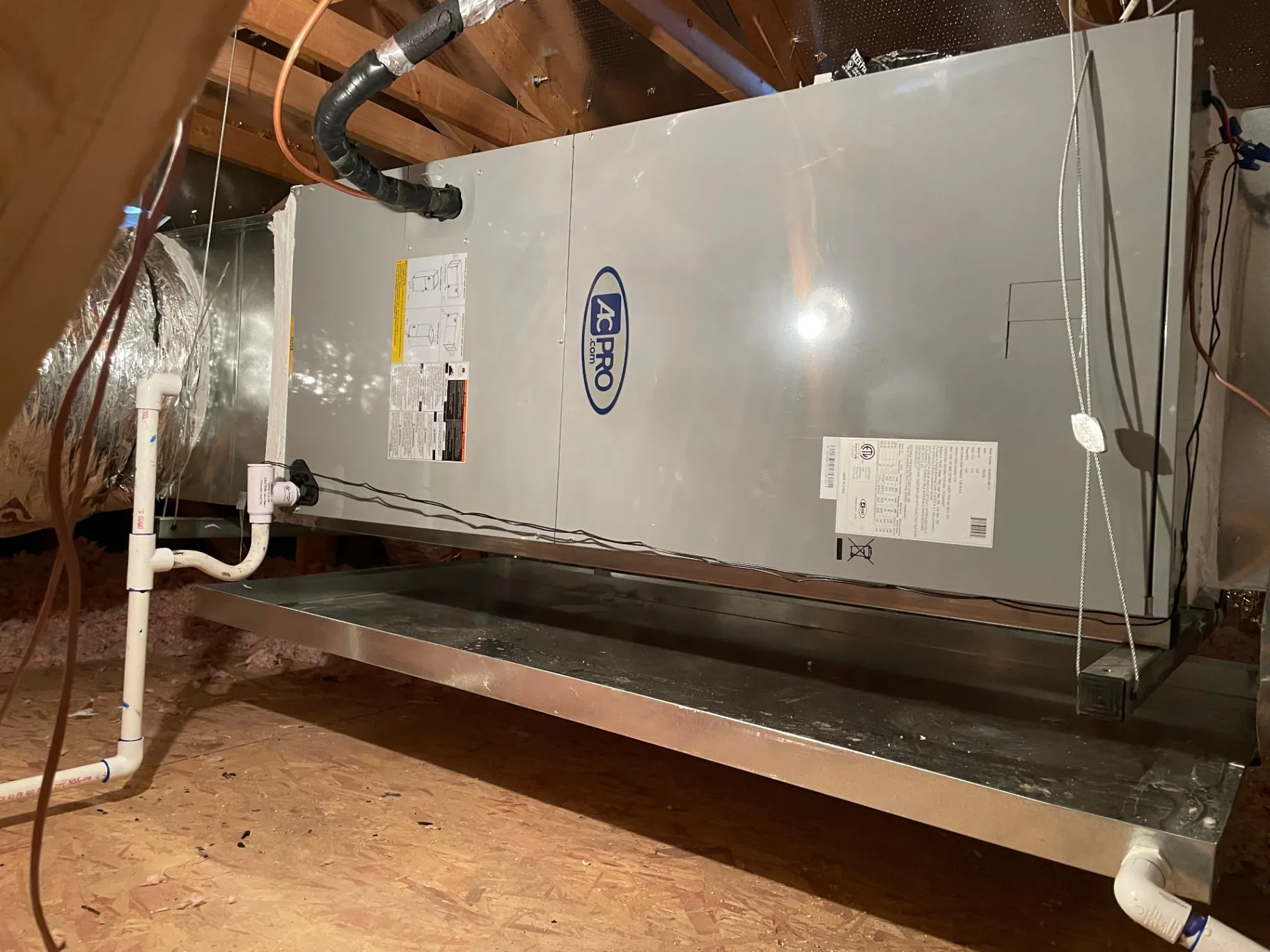 New AC Pro air handler installed in an attic service platform
