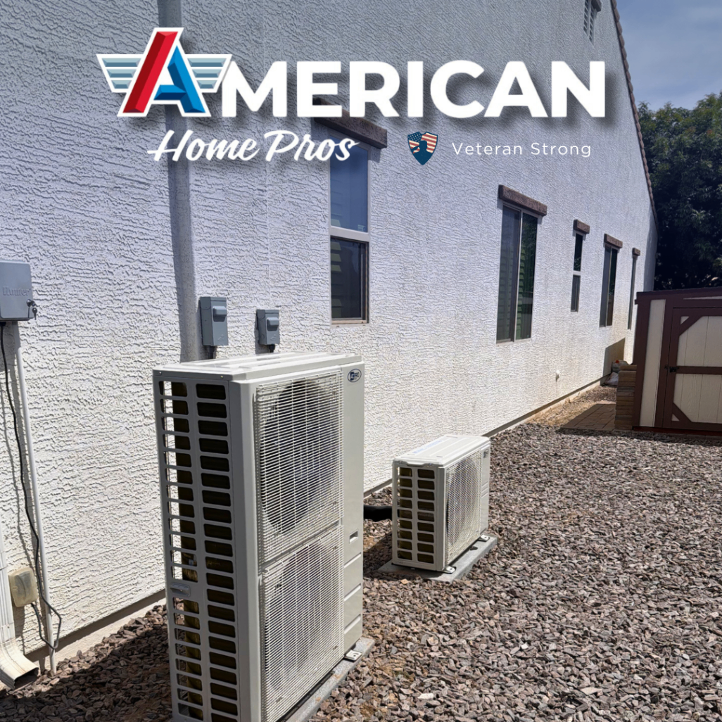 Two outdoor mini-split condensers installed along a home exterior wall