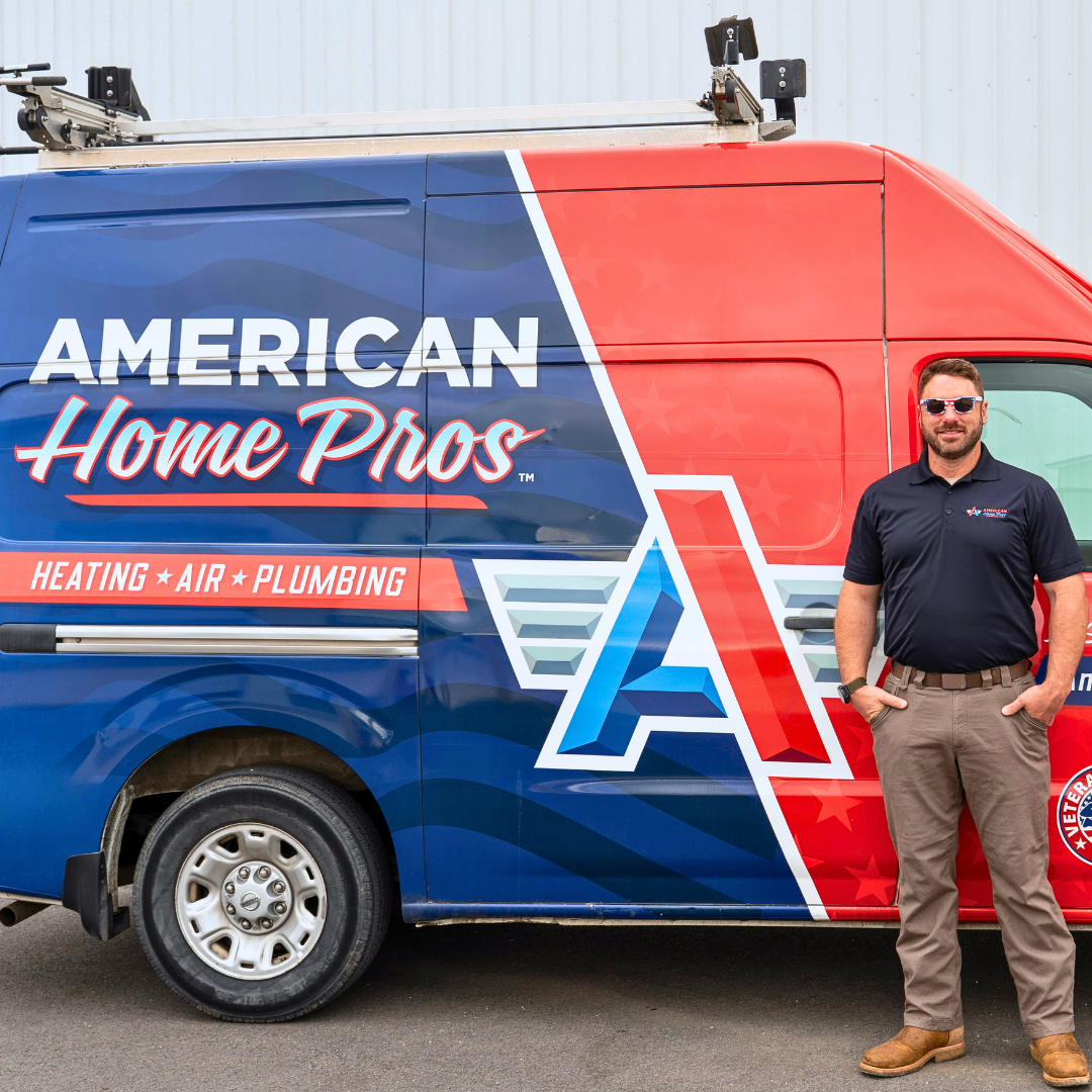 American Home Pros team member standing beside branded service van