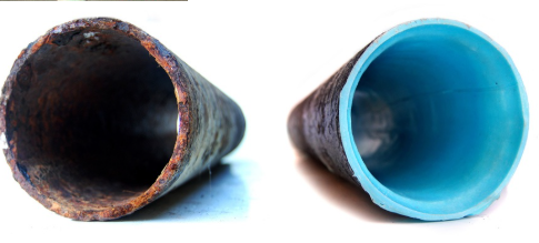 A corroded, rusted-through cast iron drain pipe next to the same pipe rehabilitated with a smooth blue CIPP liner.